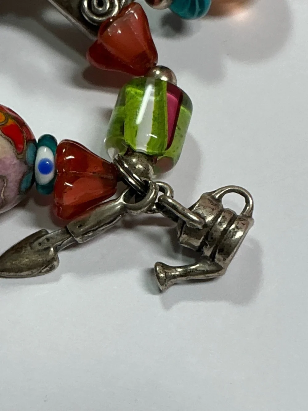 Sterling Silver and Lampwork glass beads W/ 4 Sterling Silver charms. 7.5” long